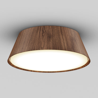 The Artika Dunham 15 in. LED flush mount light features a cylindrical wooden shade and a glowing white LED, seamlessly installed on a plain, light gray ceiling.