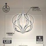 Modern LED pendant light with a chrome finish and curved, illuminated arms hangs in a minimal room. Labels highlight adjustable height, rubber diffuser (no bulbs required), integrated LED, and 5-year warranty.