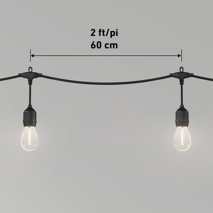 The Artika Blaze 20 LED Outdoor Solar String Lights feature black sockets and wires, with bulbs spaced 2 feet (60 cm) apart. A measurement arrow shows the distance between bulbs against a plain gray background.