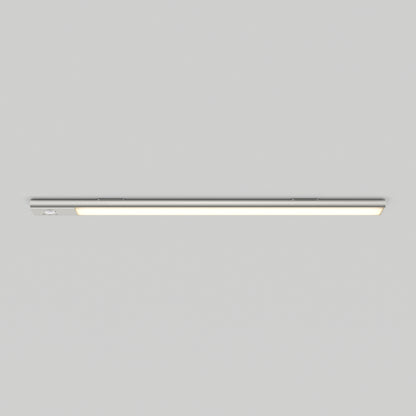 The Artika Outline under cabinet LED light 3CCT is mounted horizontally on a plain light gray ceiling, providing a modern look and emitting a soft, even glow.