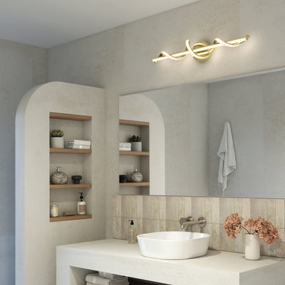 Modern bathroom featuring a vessel sink, wall-mounted faucet, built-in wooden shelves with decor, a towel on the wall, mirror, and the Artika Coda modern LED bathroom vanity light (5 CCT) above the mirror. Dried flowers in a vase on the counter.