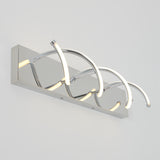 Modern wall light fixture with a rectangular chrome base and three curved LED light bars arranged in an artistic, wave-like design. The fixture is mounted on a plain white wall.