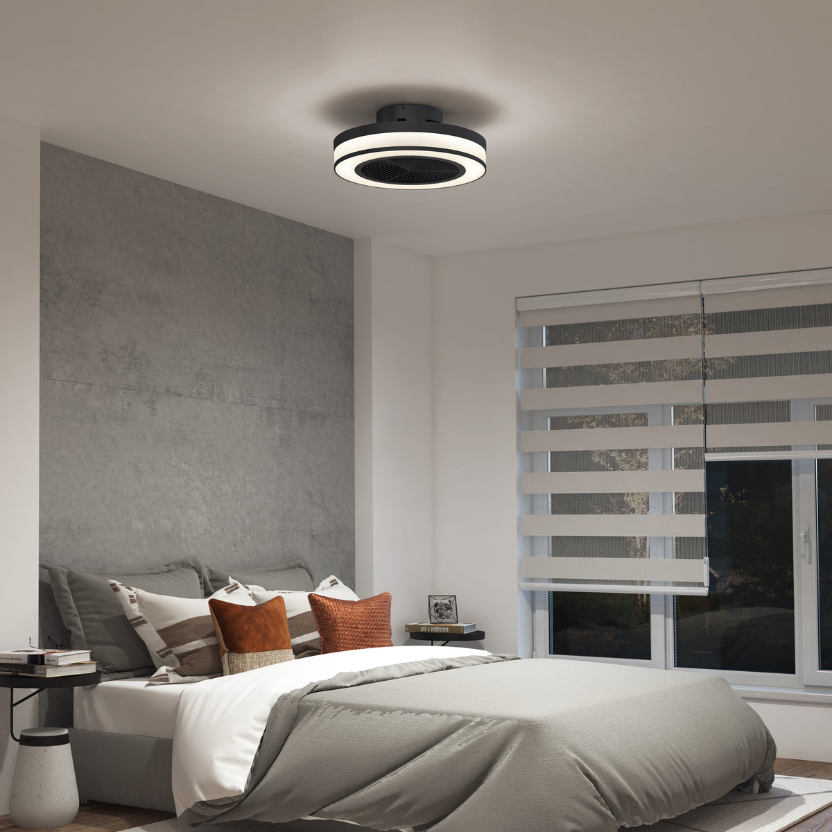 A modern bedroom with a gray accent wall, neatly made bed with gray and white bedding, brown and gray accent pillows, a round ceiling light fixture, and large windows with striped blinds.