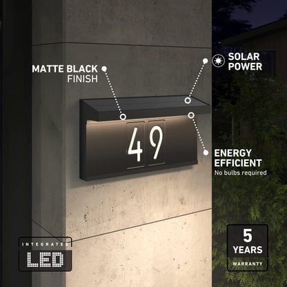 The Artika Bowen solar LED outdoor address wall light 5 CCT displays the number 49 at night with integrated, energy-efficient LEDs and a matte black finish. This maintenance-free fixture includes a 5-year warranty.
