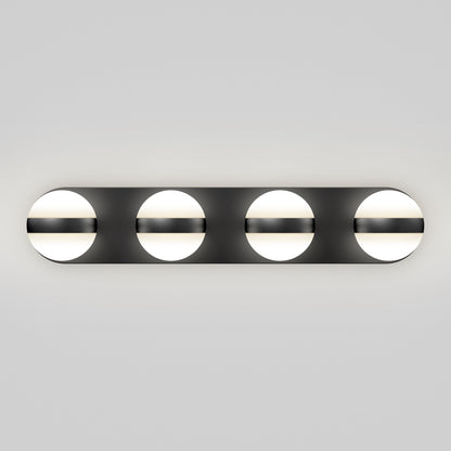 The Artika Baldric LED modern bathroom vanity light features four round white bulbs, each partially covered by a horizontal black bar, mounted on a rectangular black base for a sleek look.
