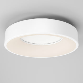 The Artika Aiden LED flush mount is a modern round white ceiling light with a sleek design, installed on a light gray ceiling and providing a soft, even glow.