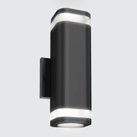 The Artika Stark modern LED indoor-outdoor light features a sleek black wall-mounted design with rounded edges and clear top and bottom panels for up-and-down illumination, shown against a light gray background, and includes wi-fi connectivity.