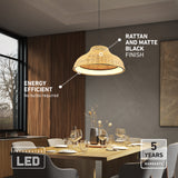 A modern dining room features a rattan and matte black pendant light above a wooden table set for six. Text highlights the lamps energy efficiency, integrated LED, and 5-year warranty. Large windows let in natural light.