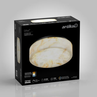 A black box displays an Artika Clifford 15 in. flush mount light 5 CCT LED with a marble-like white and gold pattern, highlighting its 5-year warranty, 50,000-hour lifespan, 1900 lumens brightness, and 18W power.