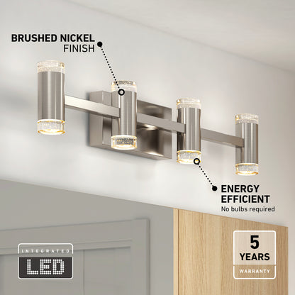 The Artika Mist modern LED bathroom vanity light 5 CCT, with a brushed nickel finish and integrated LEDs, is mounted above a mirror. The image showcases its energy efficiency and features a 5-year warranty label.