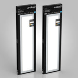Two rectangular Artika brand Sunray ceiling light panels in black packaging, standing upright against a plain gray background. The boxes feature product details and a window showing the white lights inside.