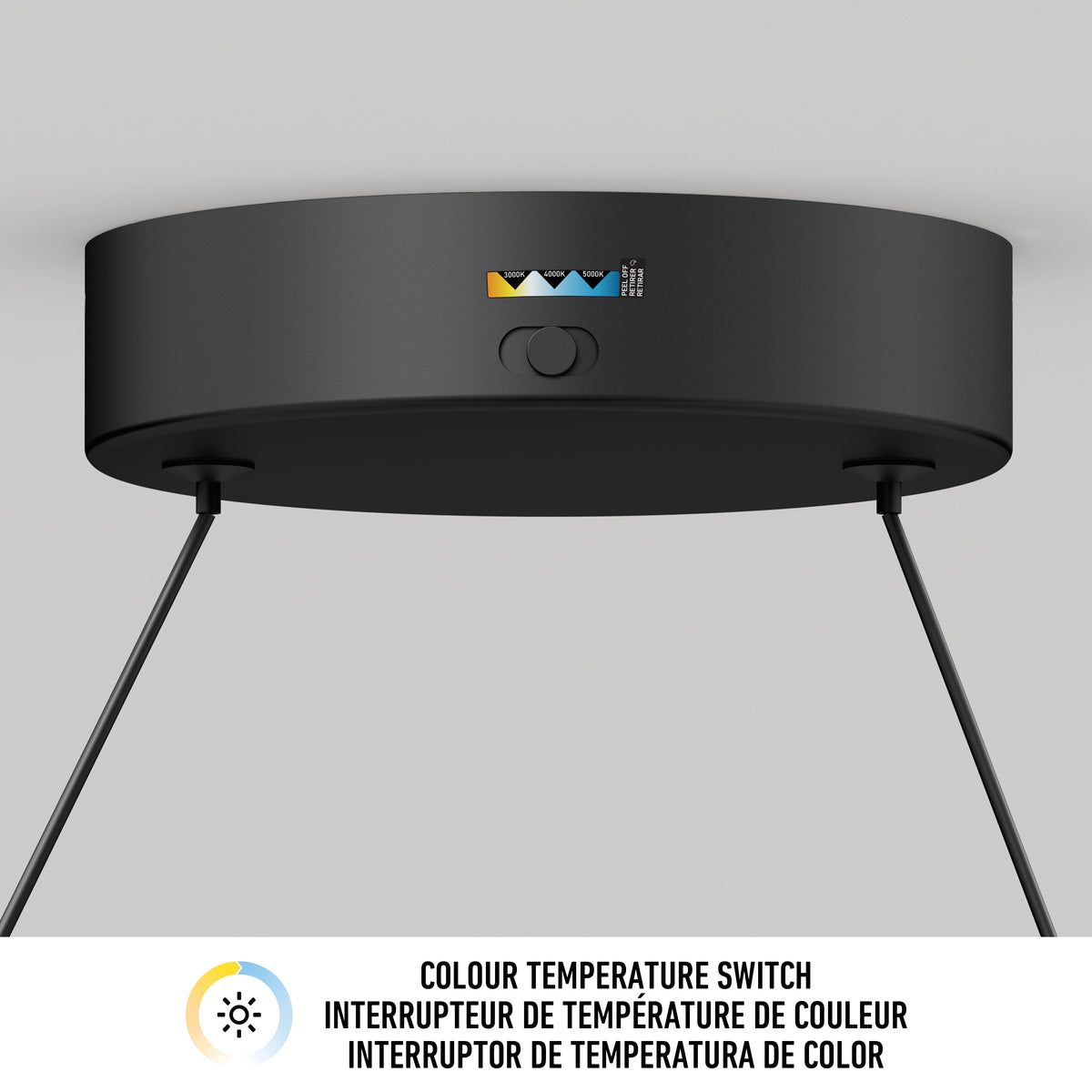 A black ceiling-mounted light fixture with a switch for adjusting colour temperature, indicated by icons in white, yellow, and blue, and text underneath reading COLOUR TEMPERATURE SWITCH in three languages.