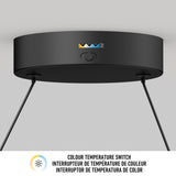 A black ceiling-mounted light fixture with a switch for adjusting colour temperature, indicated by icons in white, yellow, and blue, and text underneath reading COLOUR TEMPERATURE SWITCH in three languages.