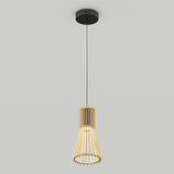 A pendant light with a black ceiling mount and cord, featuring a wooden, cage-like lampshade that tapers outward, hanging against a plain light grey background.