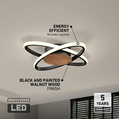 The Artika Atomic 15 in. LED flush mount light features two intersecting illuminated rings, a black and walnut wood finish base, 5 CCT selection, integrated LED, energy efficiency, and a 5-year warranty.