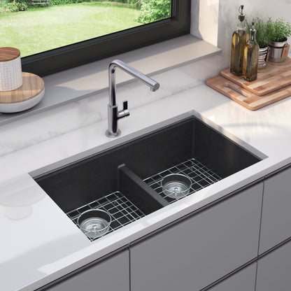 Artika Baycrest 33″ Double Bowl Black Sink with chrome faucet, countertop items, and window view.