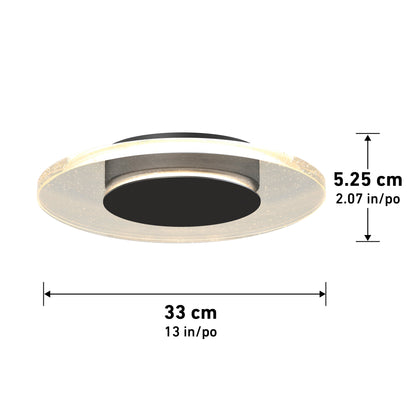 The Artika-CAN-dev Essence Disk LED flush mount is a round ceiling fixture, 33 cm (13 in) in diameter and 5.25 cm (2.07 in) high, featuring a black center, haloed glass diffuser, and translucent outer ring.