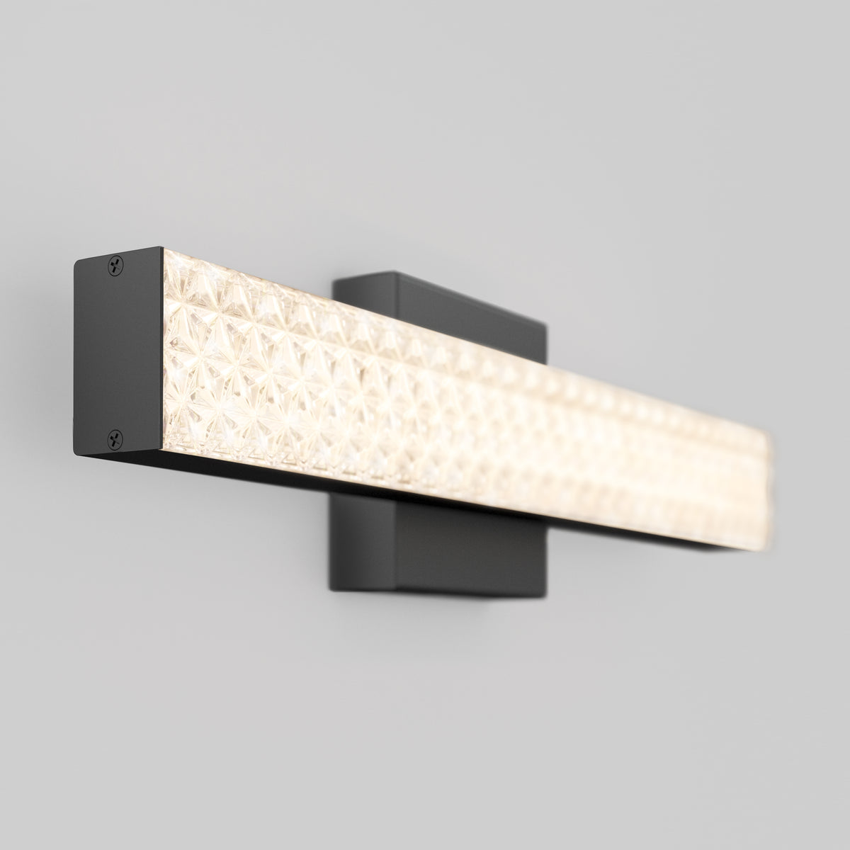 The Artika Adeline modern LED bathroom vanity light features a black base and 3 CCT adjustable lighting with a textured illuminated panel.
