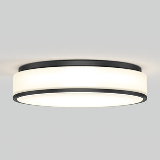 The Artika Giada 15 in. LED modern flush mount light features a black metal trim and frosted white diffuser, providing a soft, even glow on a plain light gray ceiling.
