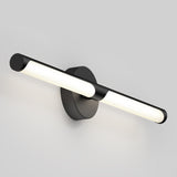 A modern black wall-mounted light fixture with a central round base and a horizontal, tubular light bar emitting a soft white glow, set against a plain light gray background.