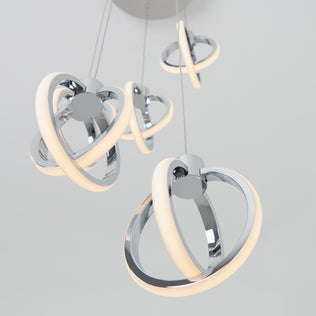 The Artika Soho modern 5-light LED pendant features multiple chrome rings with glowing LED strips, suspended from the ceiling and shown against a plain white background.