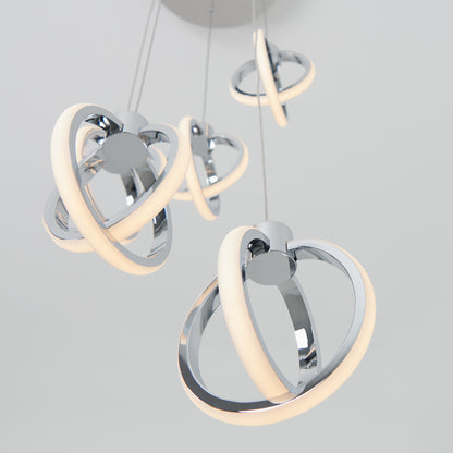 The Artika Soho modern 5-light LED pendant features multiple chrome rings with glowing LED strips, suspended from the ceiling and shown against a plain white background.