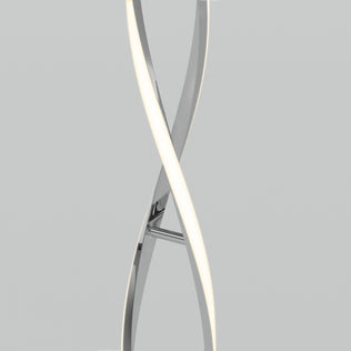 The Artika Swirl modern LED floor lamp features two intertwined, curved metallic and illuminated elements, set against a plain light gray background.