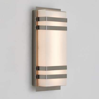 A modern wall sconce light featuring a rectangular frosted glass shade with three horizontal metal bands and a metallic backplate, mounted on a light gray wall.