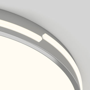 Close-up of the Artika Delray 15.7 in. LED modern flush mount light 5 CCT, featuring a matte black circular design with an integrated strip and a small gap where the ends meet. Adjustable color balance complements the sleek look on a light gray background.