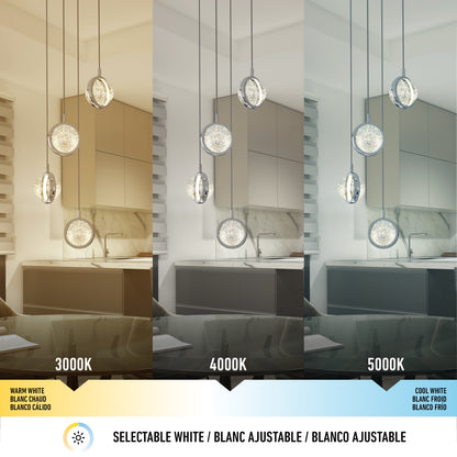 The Avalon 4-light LED pendant by Artika is shown in a kitchen with three color temperatures—warm white (3000K), neutral white (4000K), and cool white (5000K)—highlighting its adjustable lighting effects in the same space.