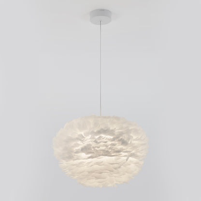 The Artika Plume LED pendant light features a spherical, feather-like white shade suspended by a thin cord, creating a modern look against any plain white ceiling.