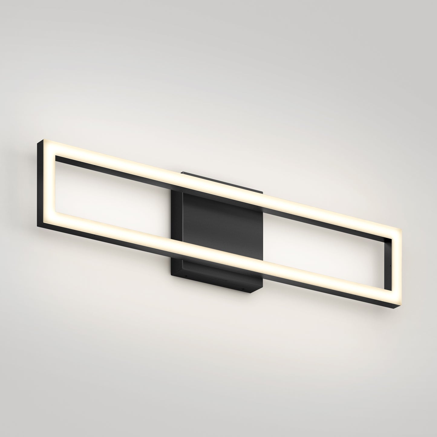 The Artika Dover modern LED bathroom vanity light 5 CCT features a rectangular black base and illuminated frame, casting soft white light against a light gray wall for a sleek, contemporary look.