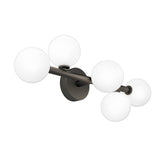 A modern wall sconce featuring a dark metal base and two rods, each holding three round white frosted glass globes as light fixtures, arranged in an intersecting design.
