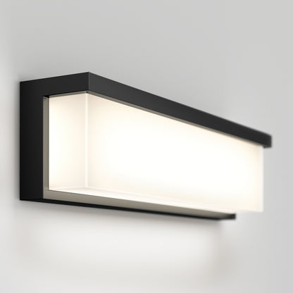 The Artika Bristol modern LED bathroom vanity light 3 CCT features a sleek rectangular black frame and frosted white panel, mounted on a light gray wall, providing soft, even illumination.