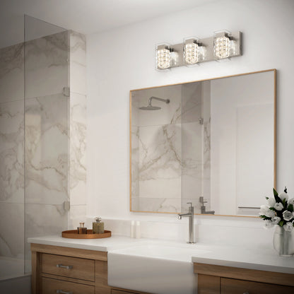 Modern bathroom with a large mirror, wood vanity, white countertop, a vase of flowers, marble shower with glass door, and the Artika Crystal Cube LED bathroom vanity light 5 CCT mounted above the mirror.