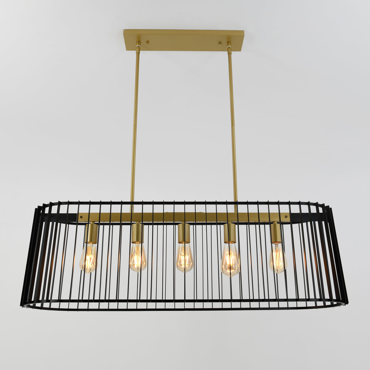 The Artika Gatsby LED pendant light features five exposed bulbs and vertical black metal bars with gold accents, suspended by two gold rods for a modern look against a white background.