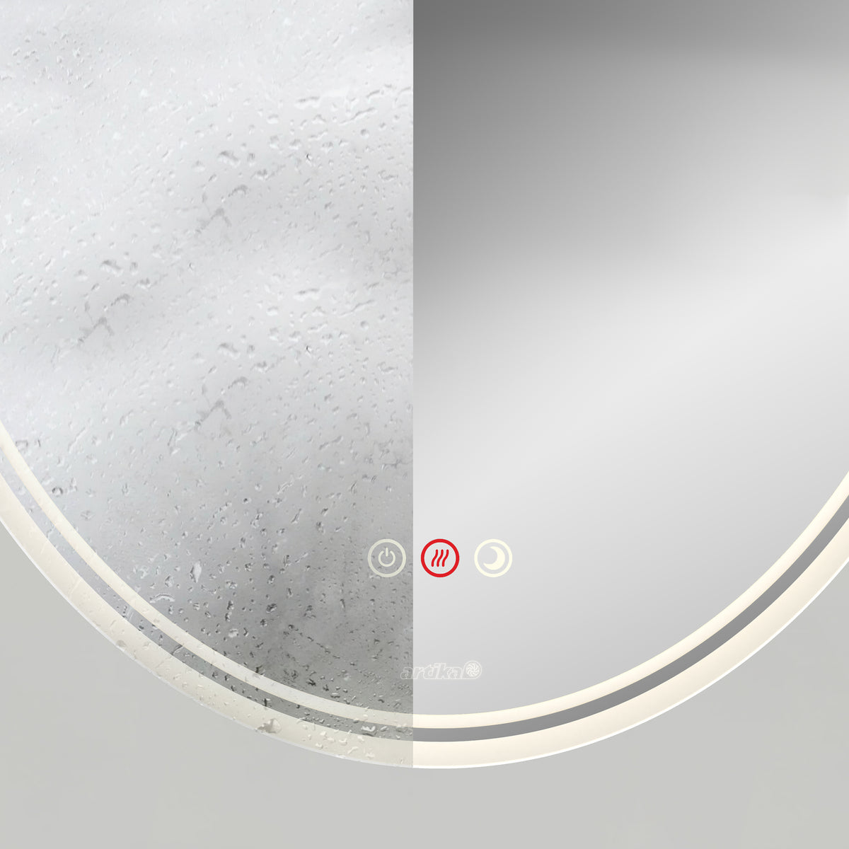 A round mirror split in half vertically; the left side is foggy with water droplets, while the right side is clear. Three touch buttons with icons are visible on the lower edge of the mirror.