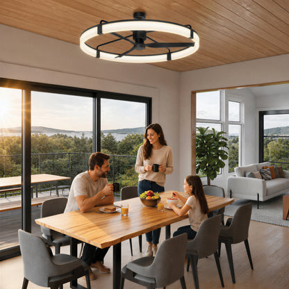 A family of three enjoys breakfast by large windows under the Artika Sunnyvale 52″ LED Modern Ceiling Fan with Remote.