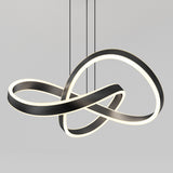 A modern pendant light with intertwined, looped LED strips in a black and white finish, suspended from the ceiling by three thin cables against a plain gray background.