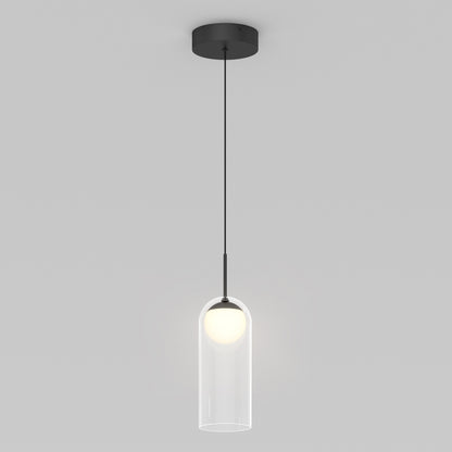 The Artika Mirah LED modern mid-century pendant light 3 CCT features a black ceiling mount and cord, with a round white bulb in a clear cylindrical glass shade, displayed against a plain light gray background.