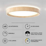 Round, wood-trimmed ceiling light with glowing LED panel, shown above features icons: LED integrated, 50,000 hours, dimmable, easy installation, 2100 lumens, and selectable white technology.