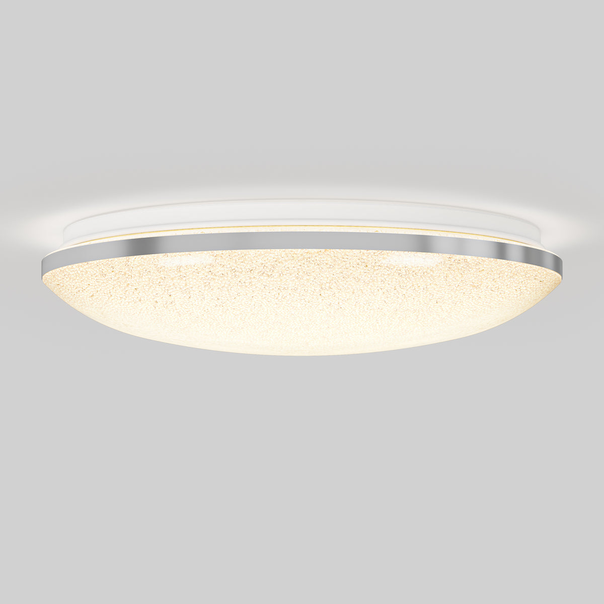 A modern round ceiling light fixture with a frosted glass dome, a metallic trim, and a soft, even glow, mounted on a plain gray ceiling.