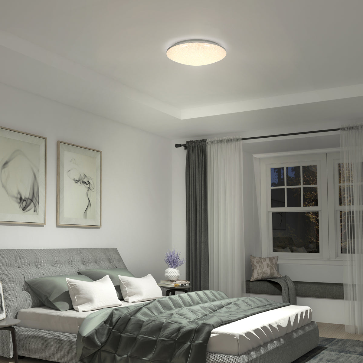 Modern bedroom with a gray bed, green comforter, wall art above the headboard, a window with curtains, a cushioned window seat, and a round ceiling light illuminating the room.