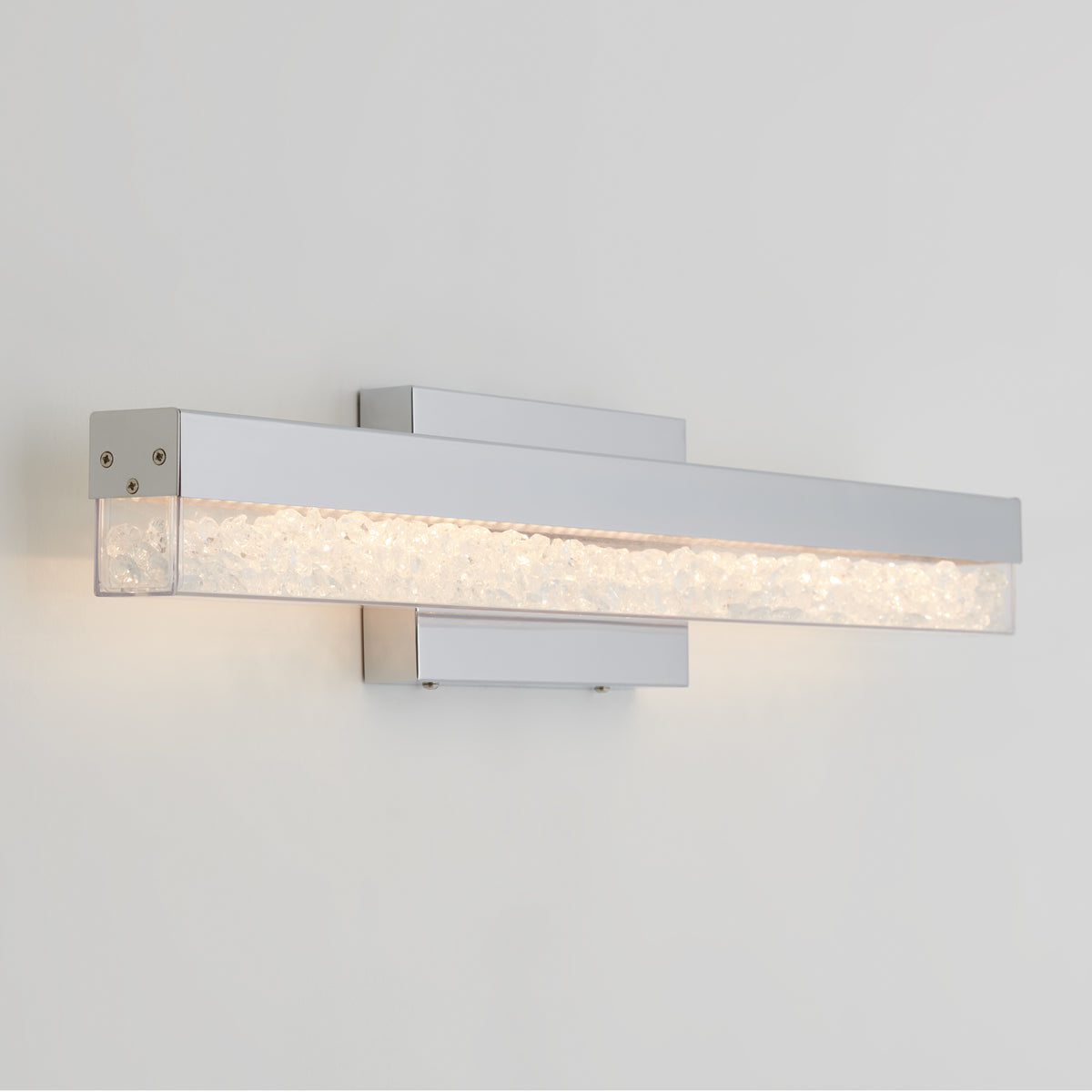 Artika Riviera 27-in LED vanity light bar with chrome finish and clear textured glass adds elegance to any bathroom wall.