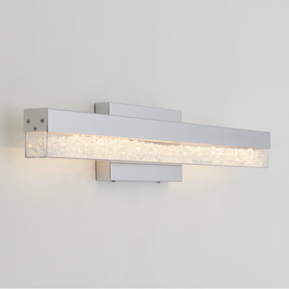 Artika Riviera 27-in LED vanity light bar with chrome finish and clear textured glass adds elegance to any bathroom wall.