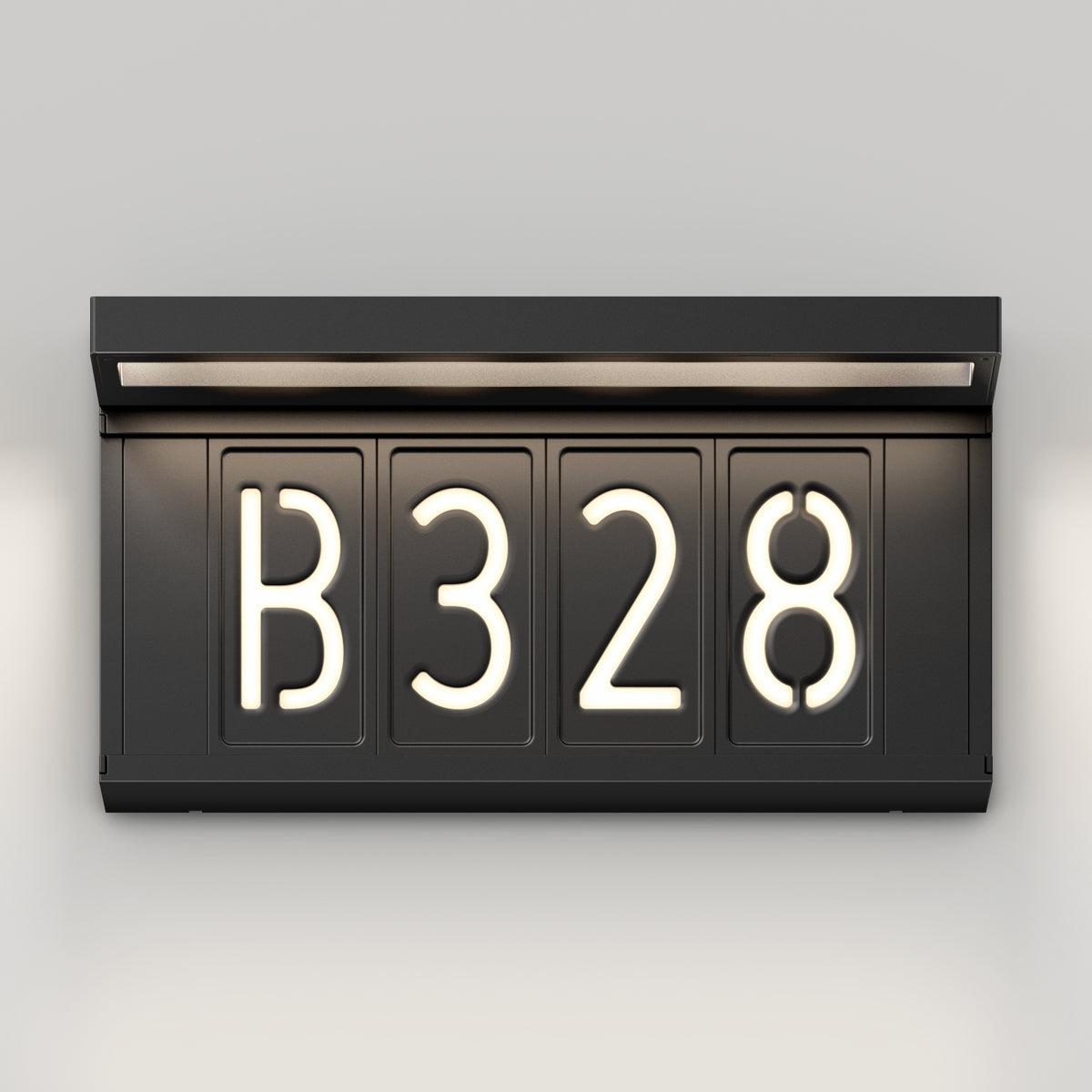 The Artika Bowen solar LED outdoor address wall light 5 CCT displays "B 3 2 8" in bright white, modern, rounded font on a black illuminated sign, mounted on a light-colored wall with a built-in top light.