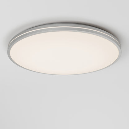 The Artika Athos 21 in. LED flush mount light features a modern round design with a white diffuser and gray trim, emitting a soft, even glow on a white ceiling. Includes remote control for added convenience.