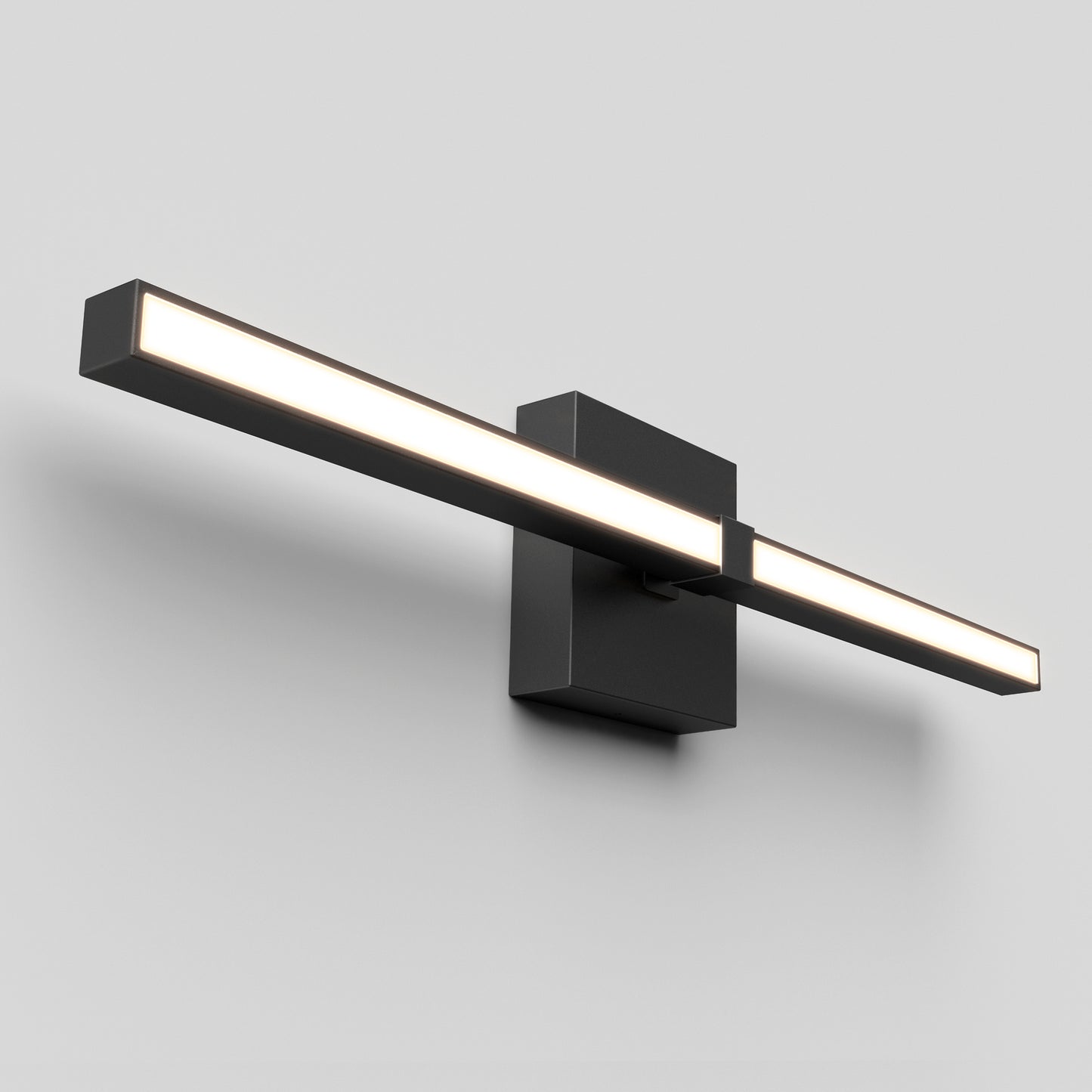 The Artika Convertible Pro 2 Wall Mounted bathroom vanity light features a modern rectangular black design with a horizontal LED bar, mounted on a square base and displayed against a plain light gray wall.