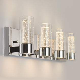 Artika Essence 27-in LED Vanity Light: sleek wall-mounted design with chrome accents and glass shade, illuminated on a neutral wall.