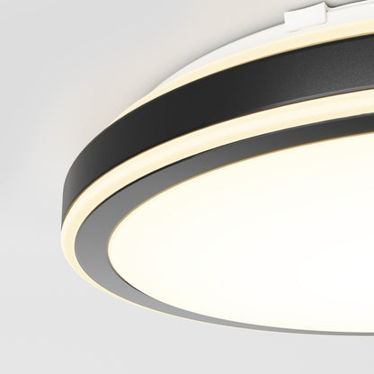 A close-up of the Artika Altitude 15 in. LED modern flush mount light, featuring black and white accents and glowing LED rings, set against a plain white ceiling. Offers 5 CCT options for perfect ambiance.
